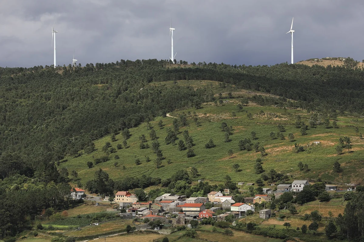 Wind turbines operating across a rural landscape